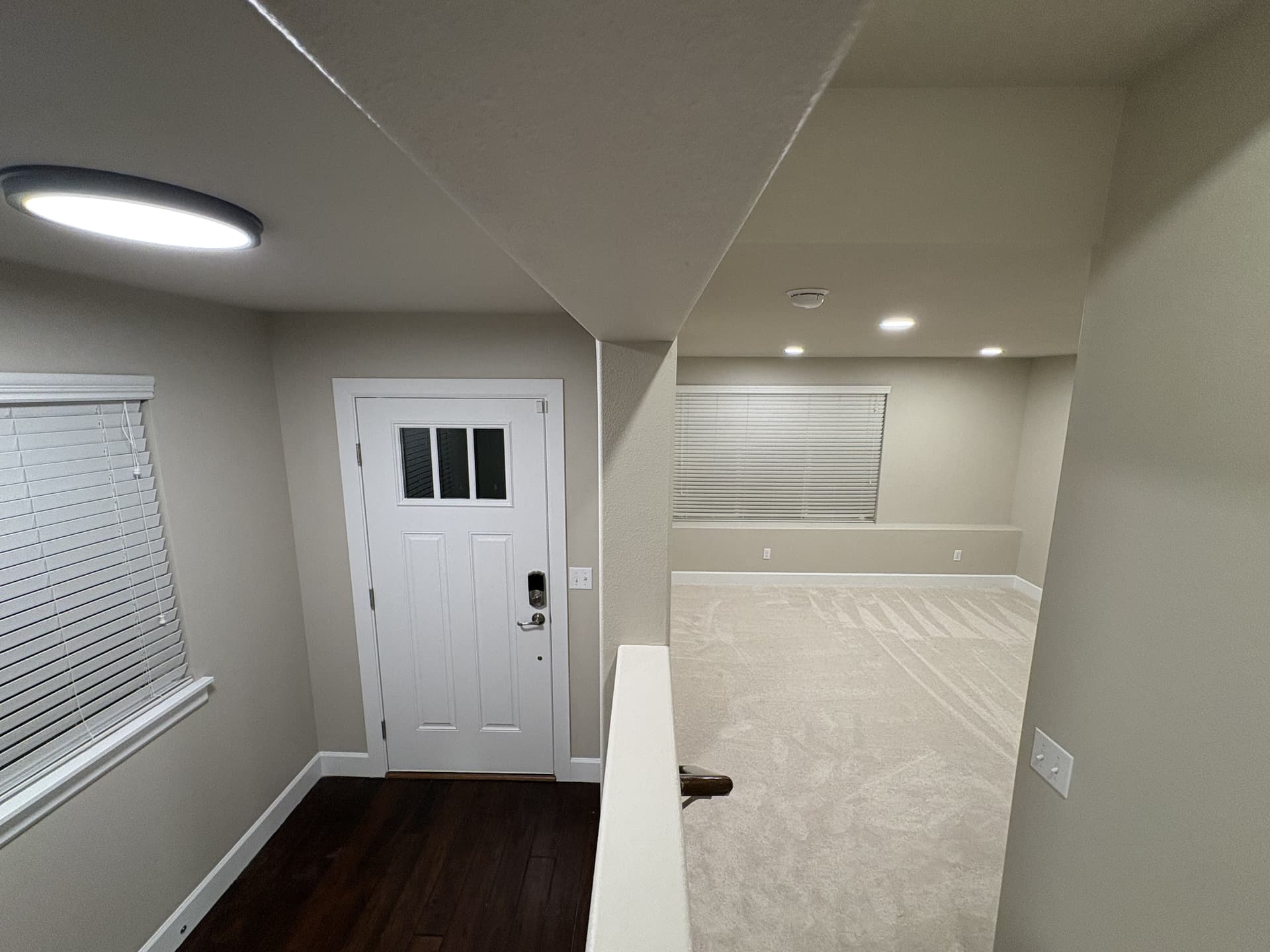 Finished entry with new front door hardware and refinished flooring