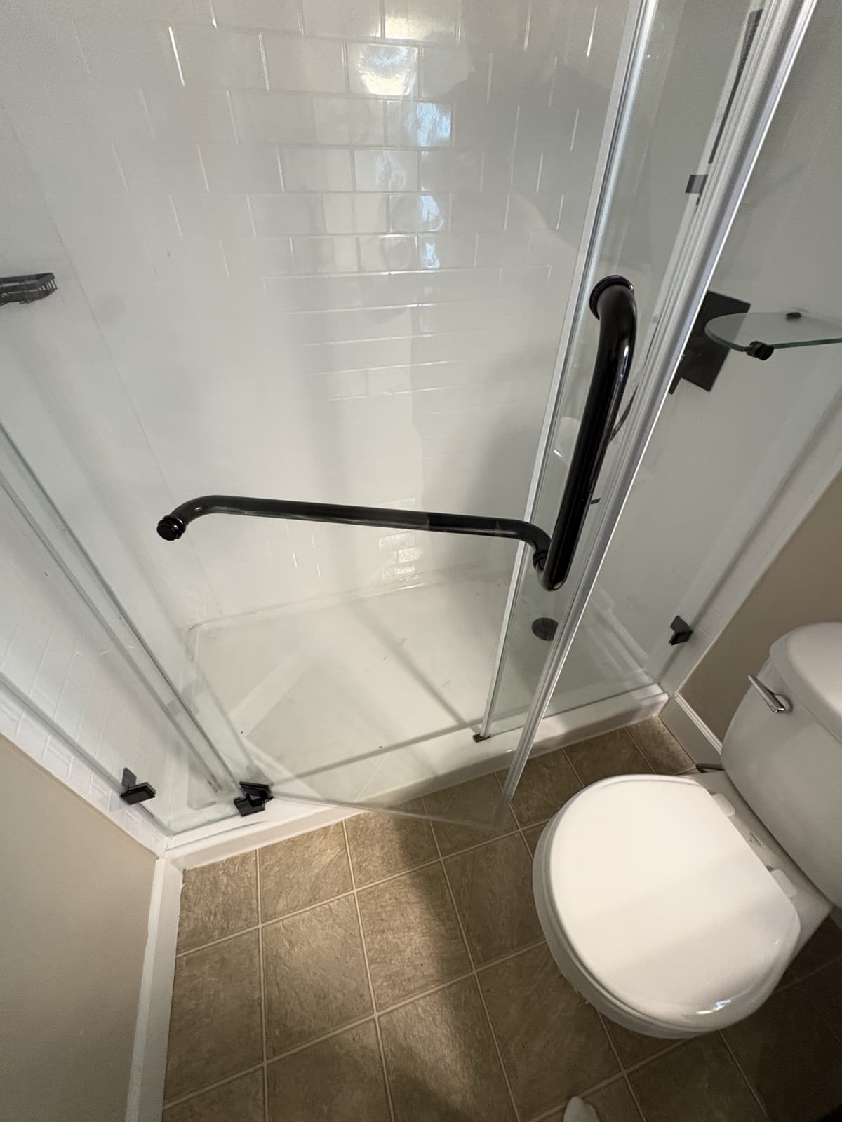 New frameless glass shower enclosure with black hardware